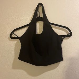 Black crop top with one strap around the neck